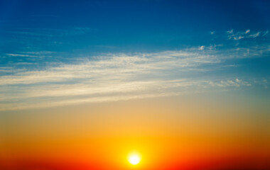 Poster - Stunning sunset with orange and blue clouds in dramatic sky