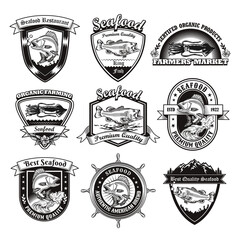 Canvas Print - Monochrome emblems for seafood restaurant vector illustration set. Vintage logotypes with fish or squid. Ocean wildlife and marine products concept can be used for stickers and badges