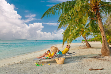 Wall Mural - Family with three year old boy on beach