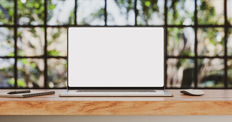 Poster - Laptop with blank frameless screen mockup template on the wooden table in industrial office loft interior - front view