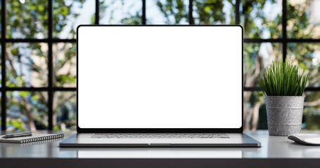 Poster - Laptop with blank frameless screen mockup template on the table in industrial office loft interior - front view