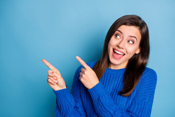 Wall Mural - photo of young beautiful happy positive good mood girl smiling look point finger in copyspace isolat