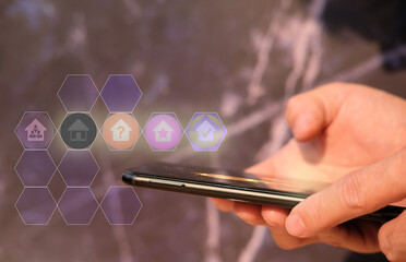 Poster - Businessman hand working on smartphone and business icon concept
