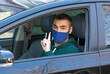 © kasperok32 - health protection, safety and pandemic concept,taxi driver showing finger up to pay attention