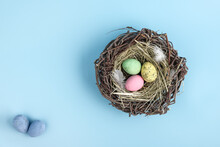 Closeup Of Easter Egg Nest Flatlay. Minimal Holiday Season Concept Background. Copy Space For Text