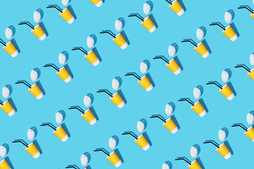 Wall Mural - Pattern yellow cardboard coffee cup on a blue background. Flat style.