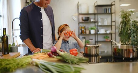 Poster - Dad and daughter having
fun cooking
