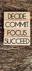 Wall Mural - Inspirational and Motivational Concept. DECIDE COMMIT FOCUS SUCCEED text with vintage background. Stock photo.