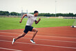 © Connect Images - Runner training on running track