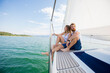© Image Source - Young couple sailing on Chiemsee lake, Bavaria, Germany
