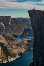 Hiker Enjoying View On Cliff Top, Preikestolen (Pulpit Rock), Lysefjord, Norway, Stavanger