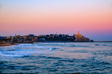 Seascape With Distant View Of Old Port Skyline And Church Of St Peter At Dawn, Jaffa, Tel Aviv, Israel