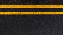 Asphalt Background With Yellow Lines