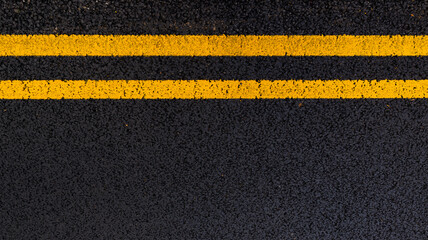 Asphalt background with yellow lines