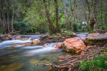 Beautiful river stream in the forest. Waterfalls and silky river stream in the mountain gorge of Fragas de Sao Simao - Aldeias de Xisto - Portugal