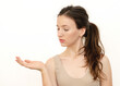 © nhannan - portrait of a young beautiful woman holding something in her hand