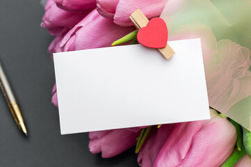 Wall Mural - Blank card with bouquet of tulips. Close up. Copy space. Holiday card. Postcard.