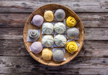 Steamed Bun,yellow Steamed Bun ,purple Steamed Bun On Bamboo Basket In Morning Top View Wooden Background