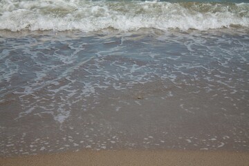 sea ​​shore. Blue waves on the blue sea. Sea shore. Sand. Summer.