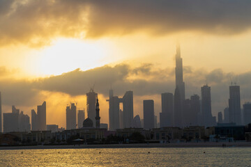 Wall Mural - Dubai, UAE - 03.06.2021 Dubai public beach with city skyline on background.Sunrise hour. Outdoor