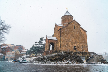 Wall Mural - Virgin Mary Metekhi church wiht covered snow