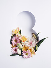 Number 8 With Fresh Spring Flowers With Green Leaves On Bright White Background. Minimal Women's Day, March 8th Or Birthday Concept. Flat Lay, Top View.