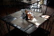 © Anatoliy - A beautiful table in a country restaurant. Light rays through a small window. Twilight
