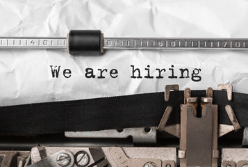 Poster - text we are hiring typed on retro typewriter