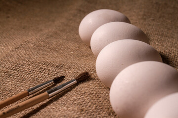 nest with eggs on a sackcloth. Happy Easter eggs. Background with easter eggs.