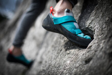 Person Climbing While Wearing Rock Climbing Shoes