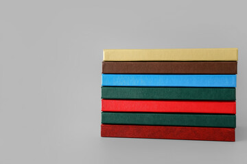 Stack of books on light background