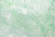 © Anastasiia - Gently green background with paint strokes. Spring or summer backdrop. Pastel. Copy space