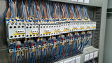 Fototapeta Sypialnia - Group of magnet starters in electrical cabinet of automation control industrial system