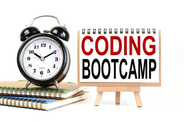 CODING BOOTCAMP. Text on white notepad paper on light background