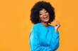 Fashionable black woman on orange background.