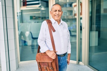 Wall Mural - senior businessman smiling happy walking at the city.