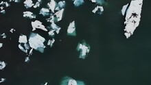 Jökulsárlón, Jokulsarlon Glacier Lagoon In Iceland With Icebergs Floating Around Melting At Sunset From An Aerial View With A 4k Drone In Cloudy Weather, Part5