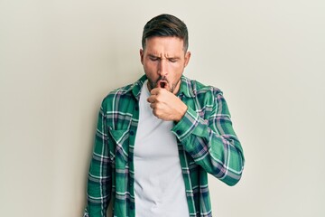 Wall Mural - Handsome man with beard wearing casual clothes feeling unwell and coughing as symptom for cold or bronchitis. health care concept.