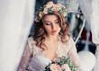 Soft focus portrait of beautiful bride with wedding hairstyle and makeup