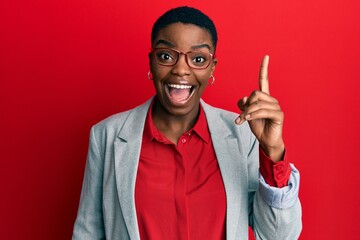 Sticker - Young african american woman wearing business jacket and glasses pointing finger up with successful idea. exited and happy. number one.