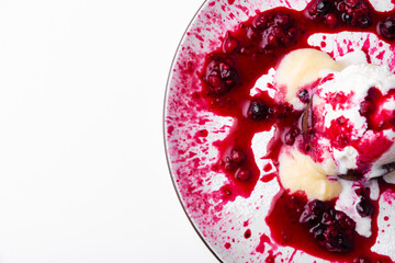 Photo of delicious tasty ice cream with berries and brownie