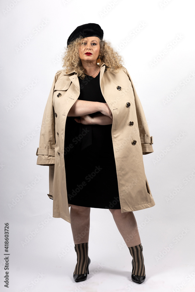mature plus size model woman wearing black clothes and trench coat 