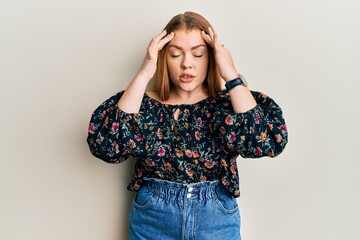 Poster - Young beautiful redhead woman wearing casual floral clothes with hand on head, headache because stress. suffering migraine.