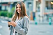 © Krakenimages.com - Young latin businesswoman smiling happy using smartphone at the city.
