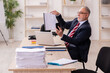 © Elnur - Old businessman employee sitting in the office