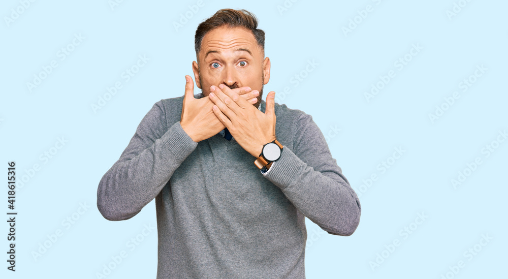 Handsome middle age man wearing business clothes shocked covering mouth with hands for mistake. secret concept.