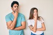 © Krakenimages.com - Beautiful young couple of boyfriend and girlfriend together bored yawning tired covering mouth with hand. restless and sleepiness.