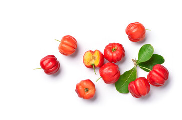 Wall Mural - Flat lay of Acerola cherry with cut in half and leaves on white background.