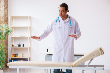 Young male doctor working in the clinic