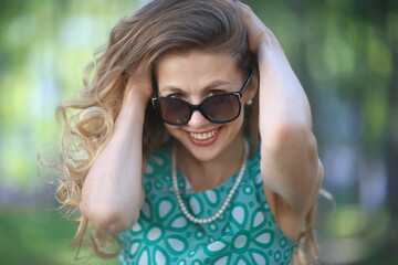 blonde summer city park walk beautiful / view beautiful young woman in urban environment outside concept vacation